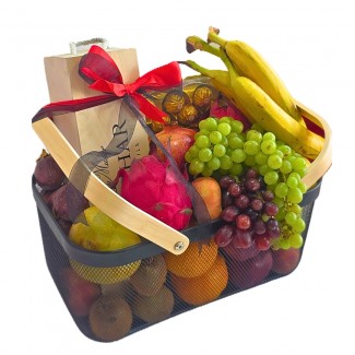 Seasonal fruits basket with chocolate and wine
